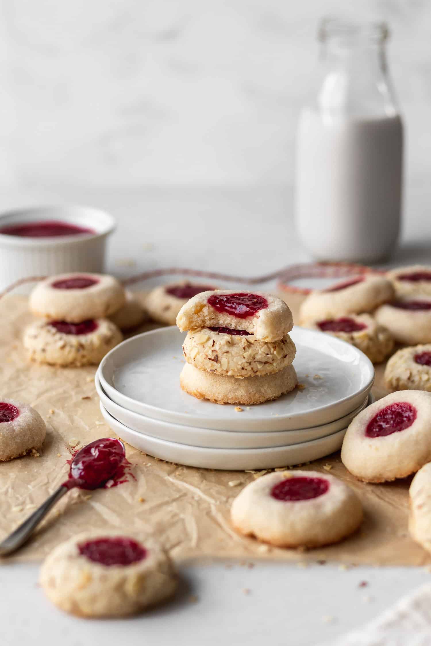 A stack of gluten free cookies on white plates