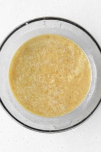 A bowl of wet ingredients for banana bread