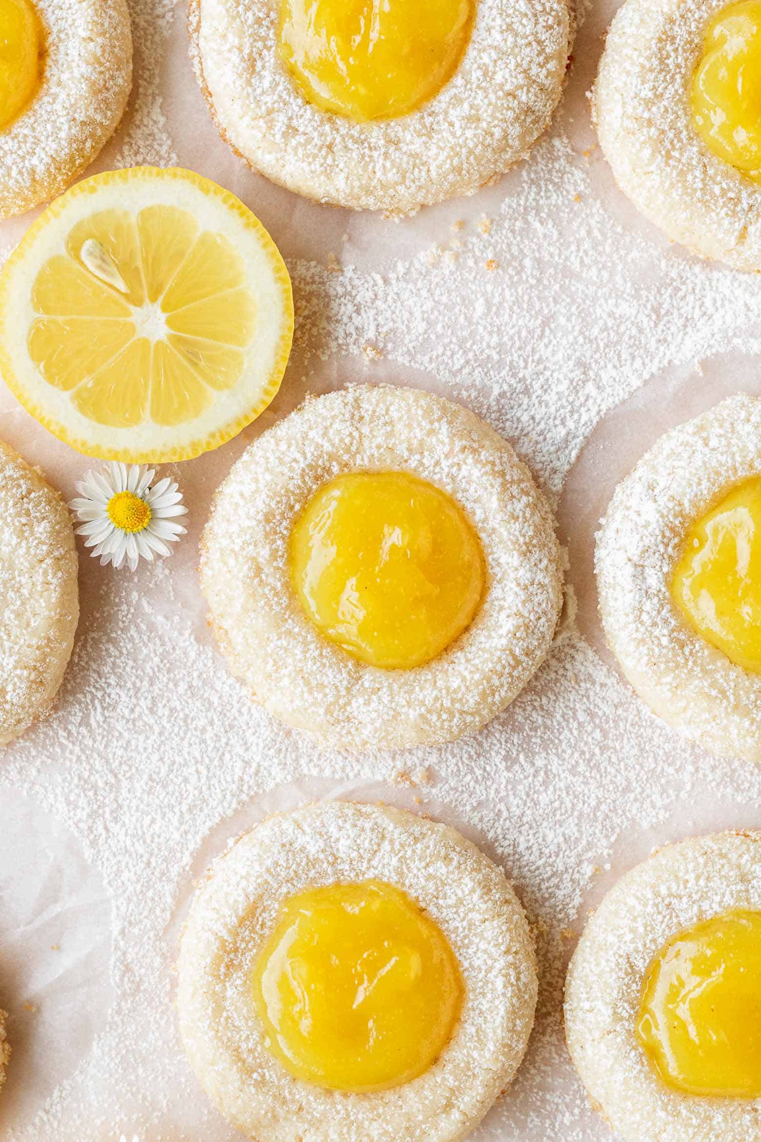 Overhead shot of lemon curd cookies dusted with powdered sugar.