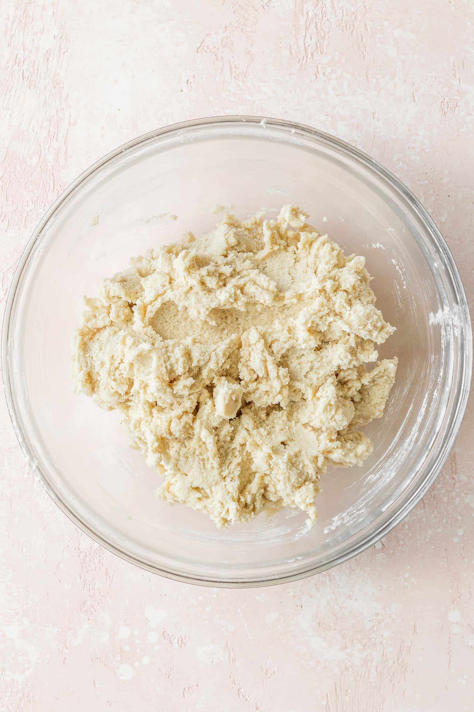 Vegan sugar cookie dough in a glass bowl.