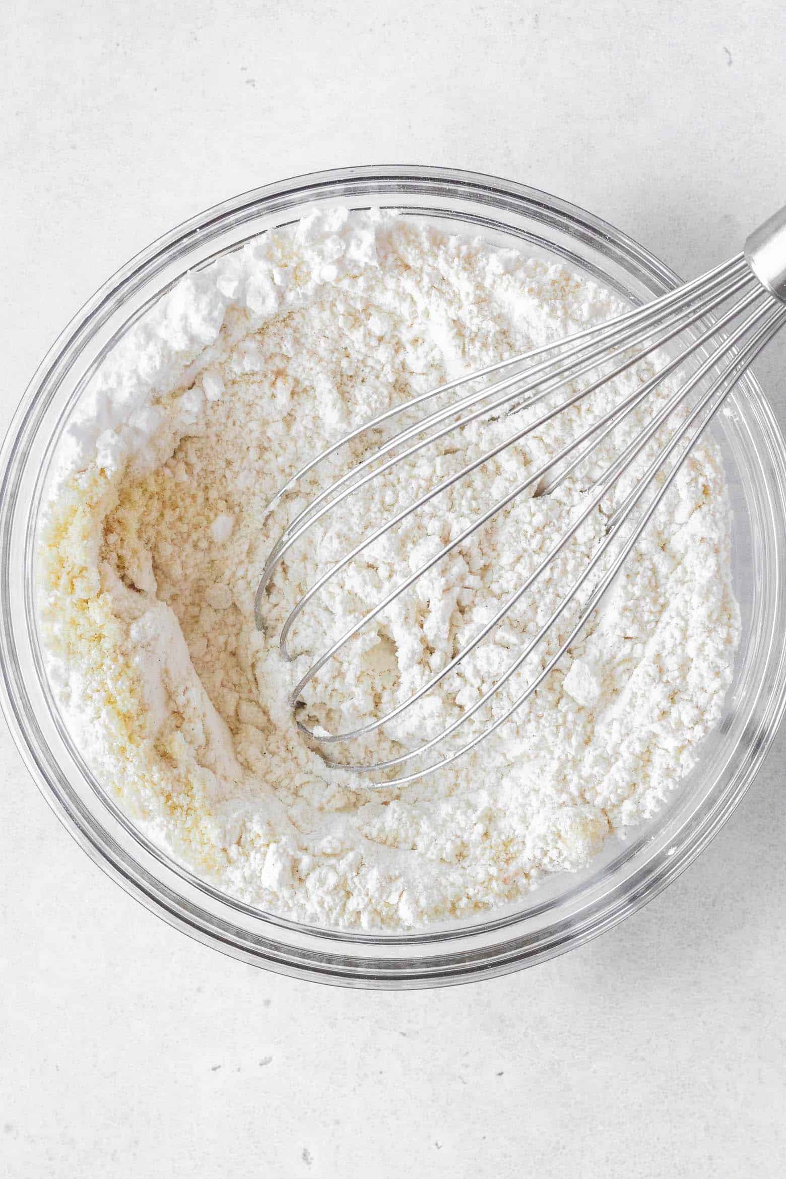 Whisk together flour and almond flour in a bowl.