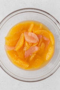 Citrus compote in a glass bowl.