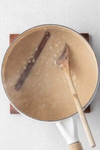 Cooked rice pudding in a pot, ready to be chilled.