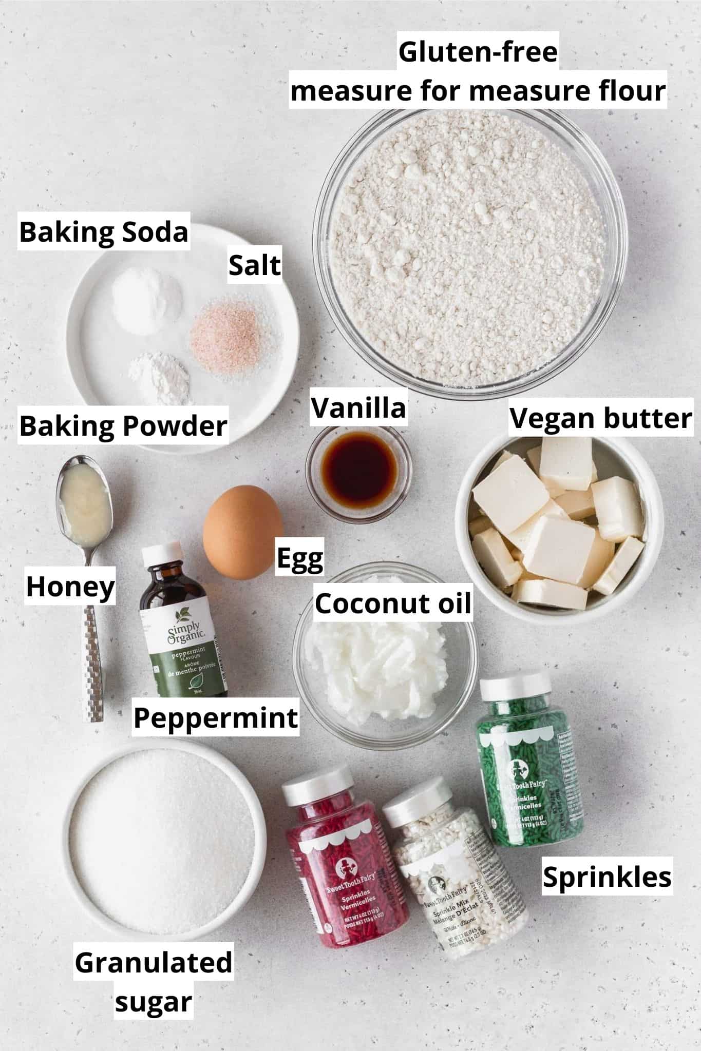 Ingredients to make gluten-free Christmas cookies measured out into bowls.