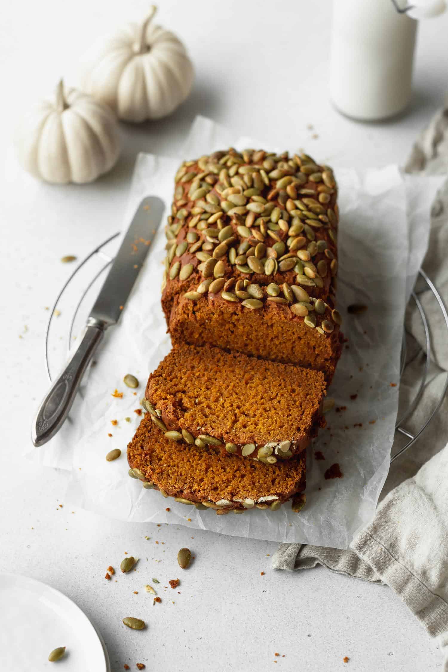 A sliced loaf of gluten free pumpkin bread.