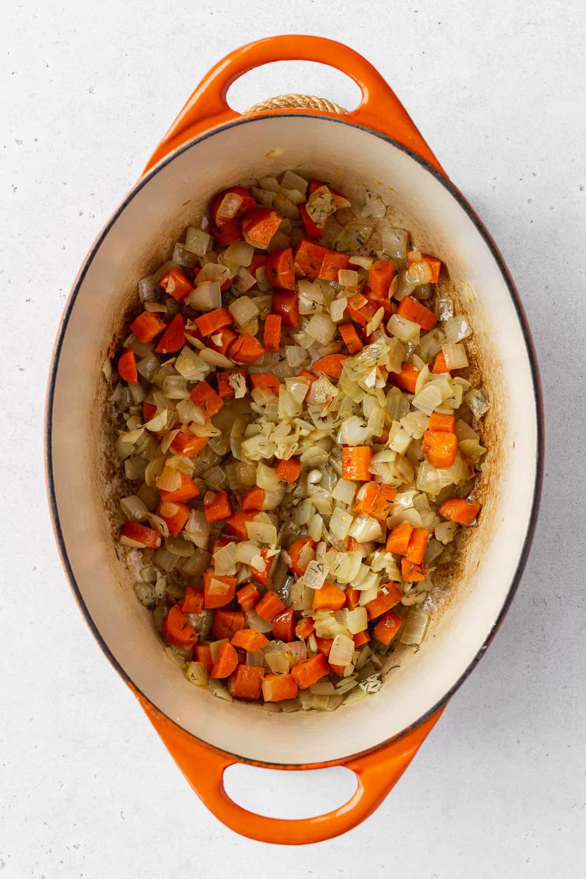Chopped onions, celery, carrots, and garlic sautéed in an enameled dutch oven.