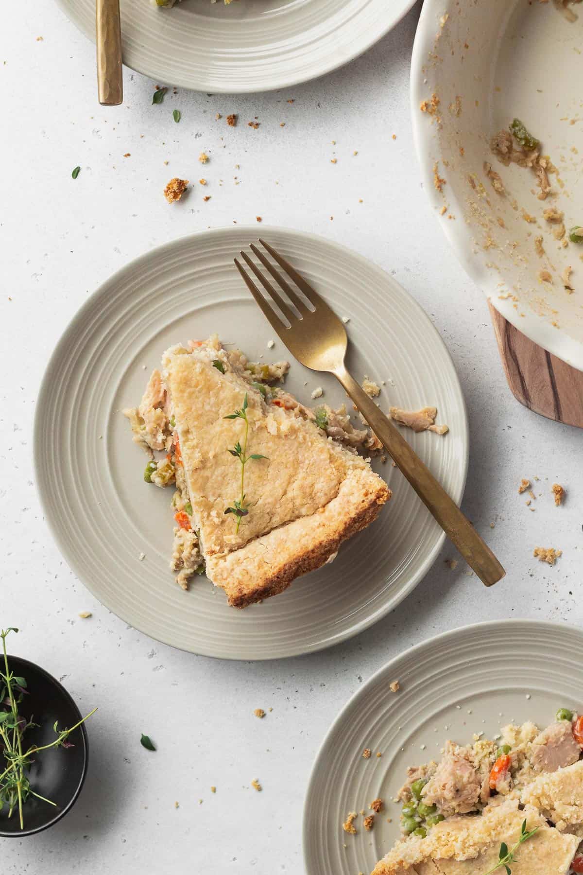 Slices of meatless chicken pot pie on plates.
