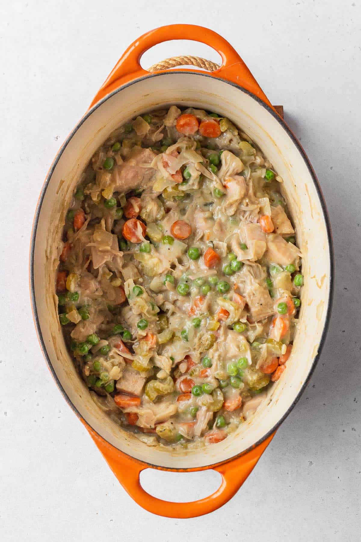 Vegan pot pie filling in an enamel pot.