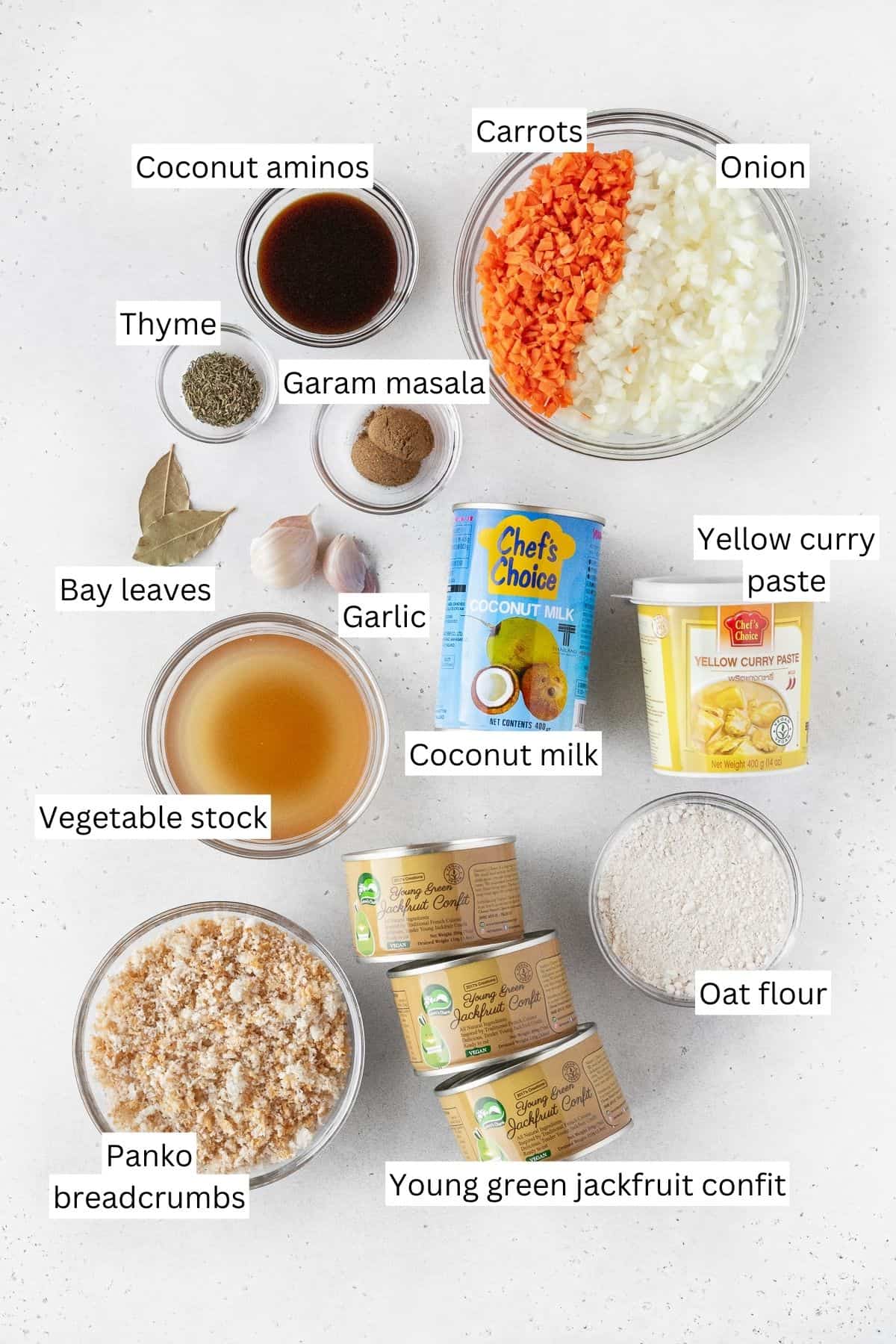 Ingredients for making Japanese vegan katsu curry laid out on a white surface with text overlay.
