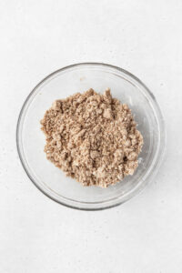 Gluten-free crumb cake topping in a glass bowl.