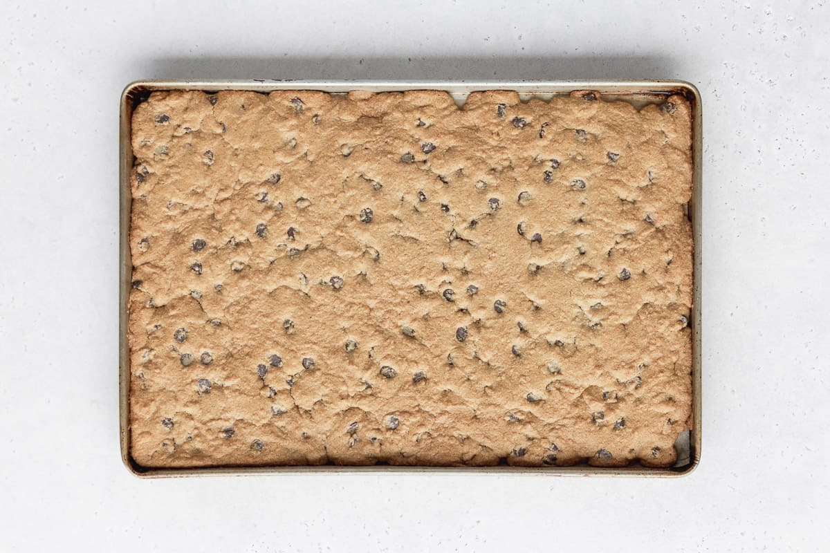 baked chocolate chip cookie dough base for making fruit flag pizza.