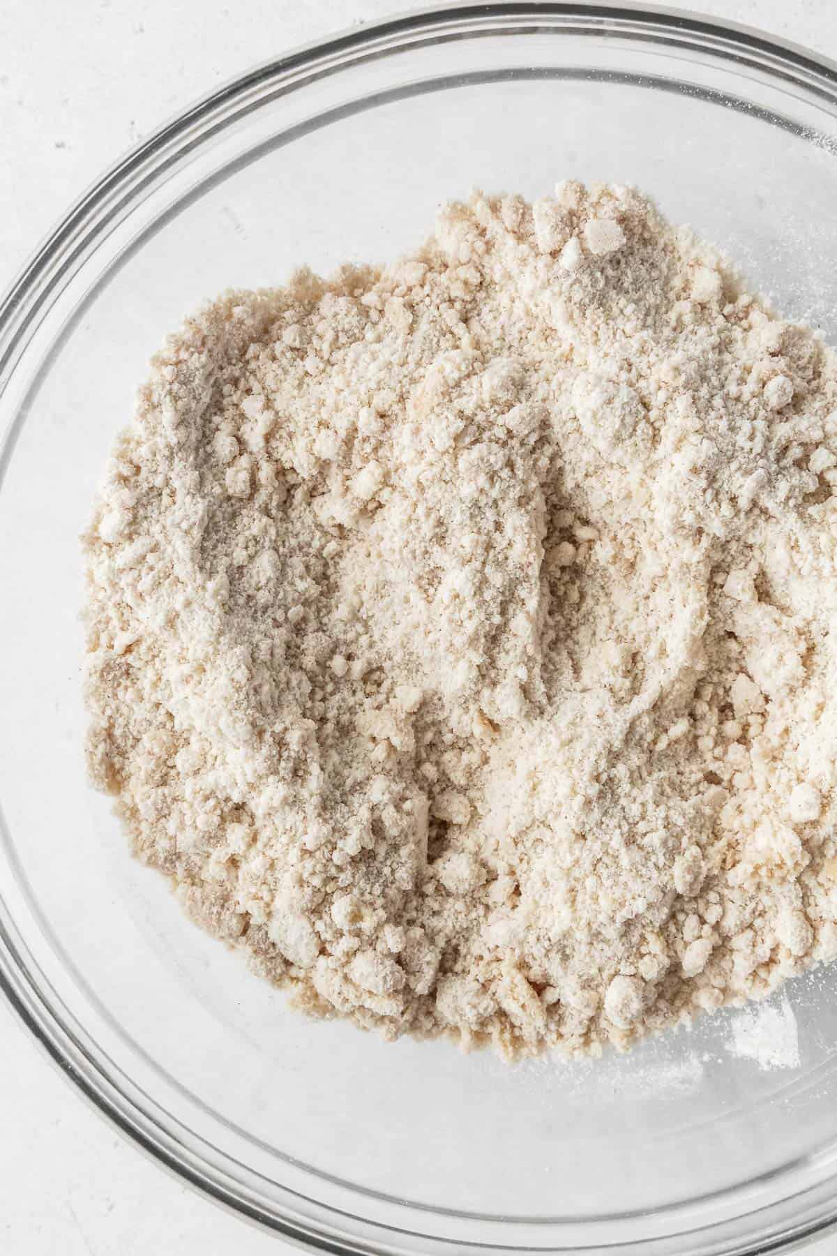 Close-up on dry ingredients after whisking with vegan butter.