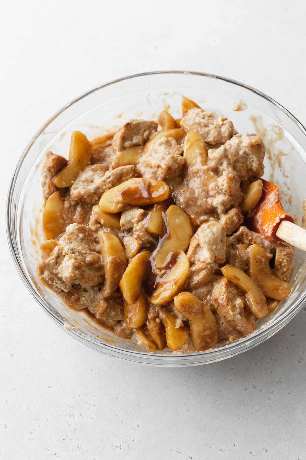 Add the apple pie filling into the soaked cubes of bread.