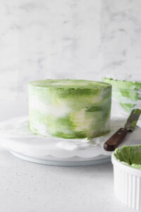 Matcha cake on a cake stand.