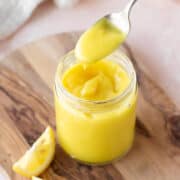 Square hero of vegan lemon curd in a mason jar.