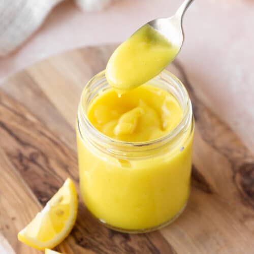 Square hero of vegan lemon curd in a mason jar.