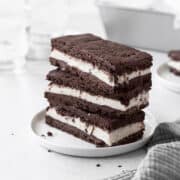 A stack of gluten-free ice cream sandwiches on a small white plate.