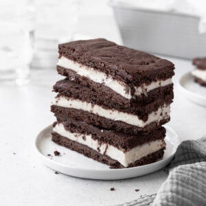 A stack of gluten-free ice cream sandwiches on a small white plate.