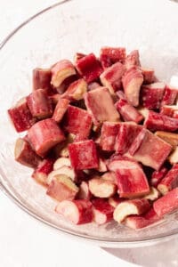 Closeup shot of chopped rhubarb after mixing with sugar and cornstarch.
