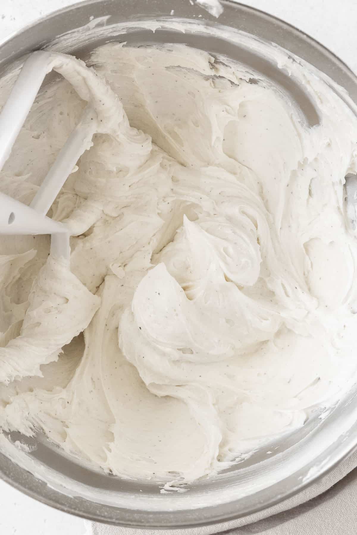 An overhead shot of a mixing bowl of the dairy free buttercream.