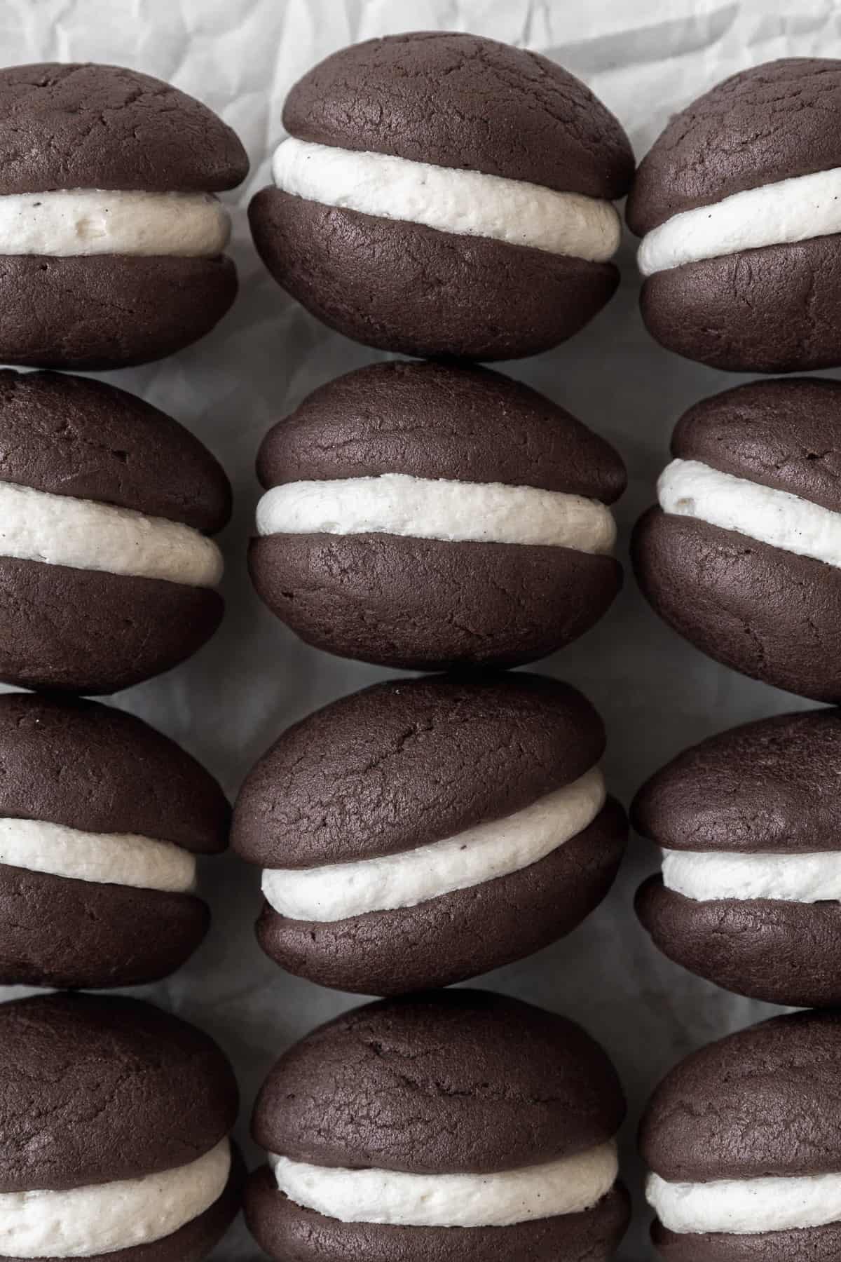 Gluten-free whoopie pies on a white parchment paper.