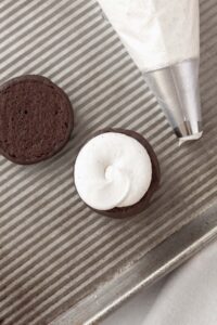 Filling the whoopie pie with the filling.
