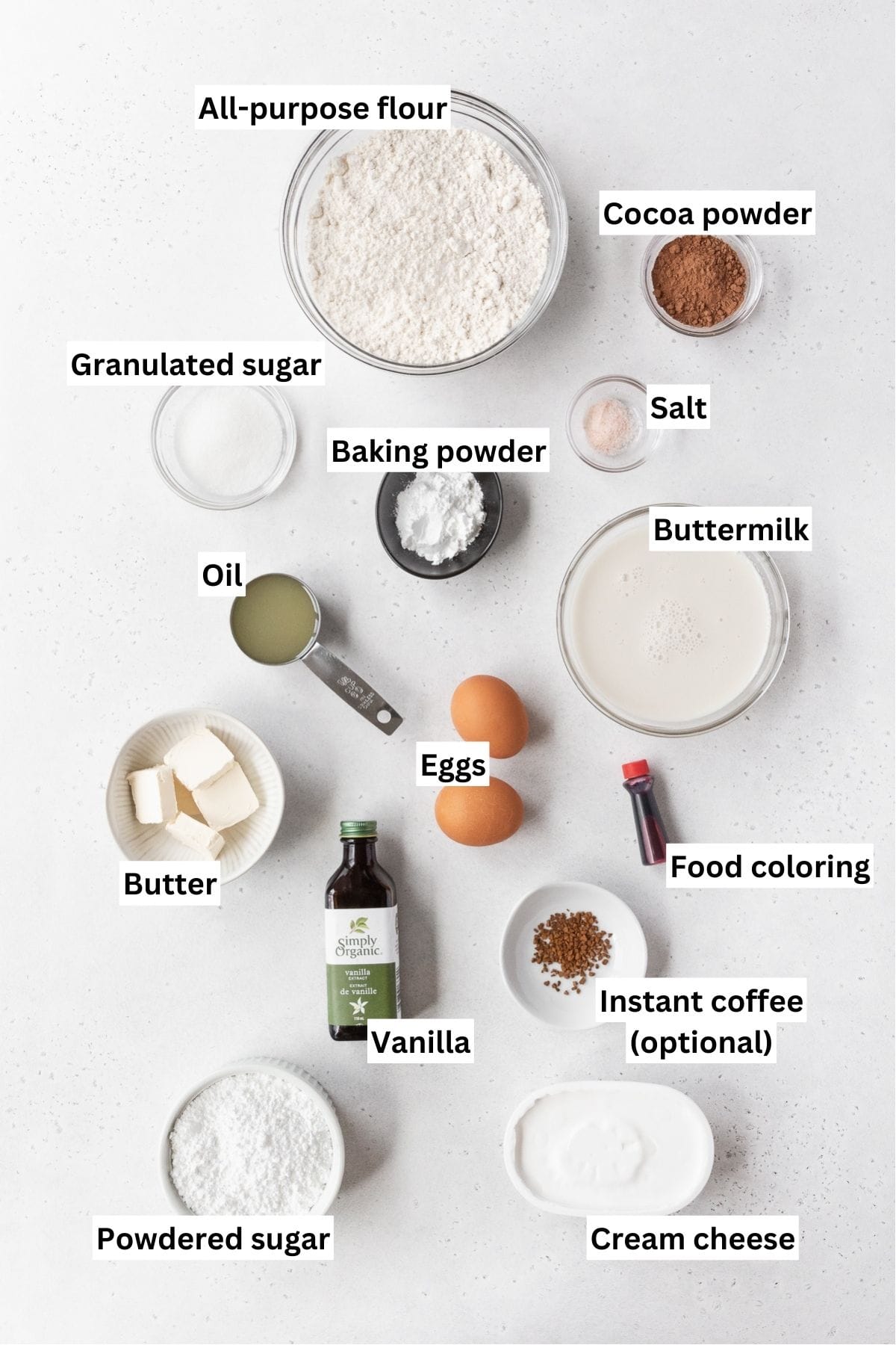 All of the ingredients for the red velvet waffles on a white counter.