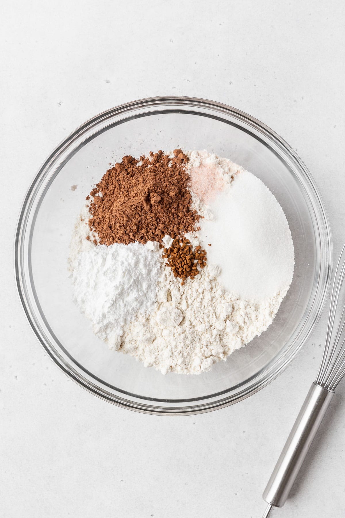 A glass mixing bowl of all of the dry ingredients.