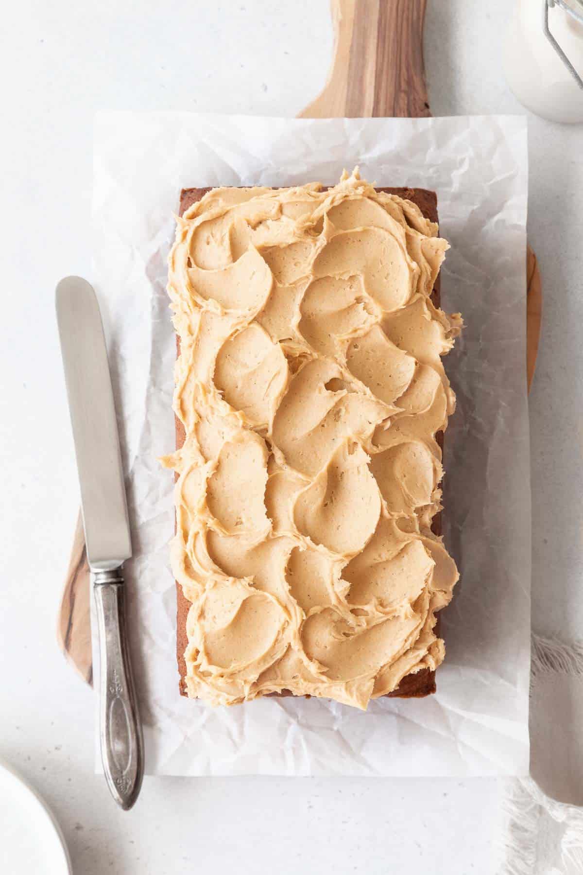 A frosted loaf of sweet potato cake.