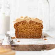 A square image of a sweet potato cake with cashew frosting.