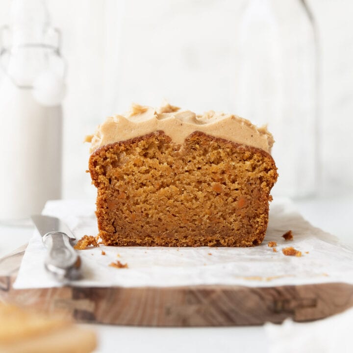 A square image of a sweet potato cake with cashew frosting.