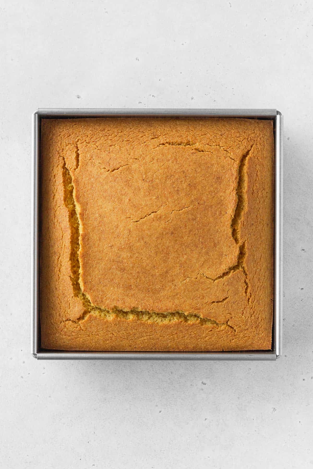 An overhead shot of a pan of baked cornbread.