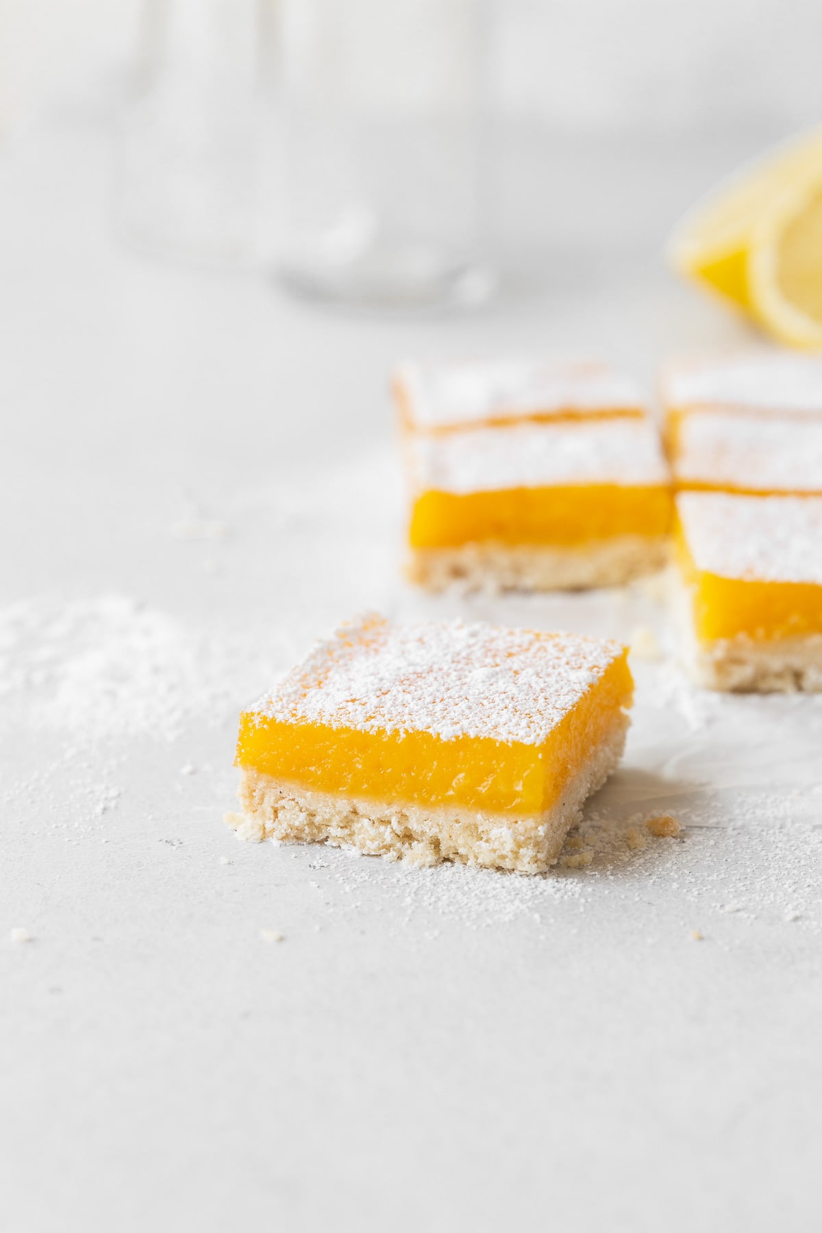 A side shot of cut of lemon bars on the counter.