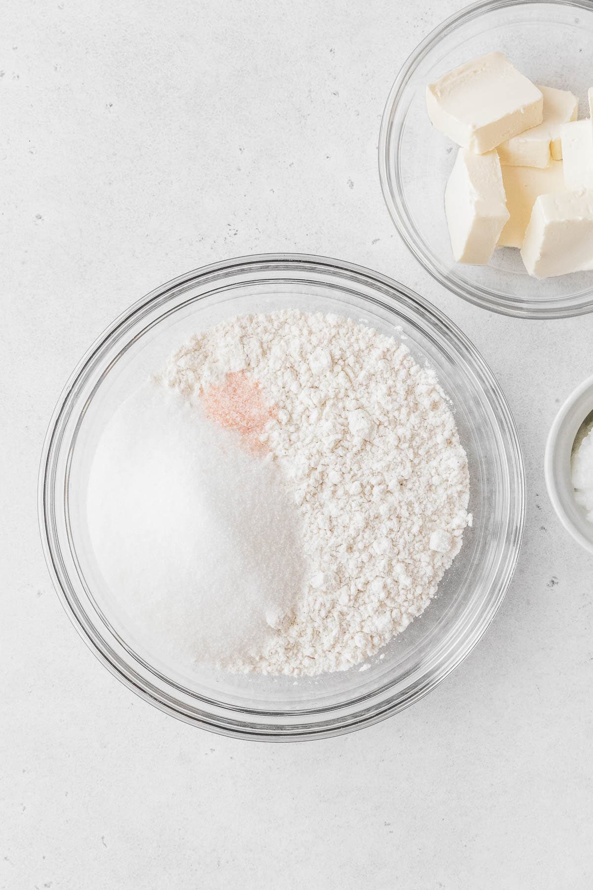 Flour, sugar, and salt in a mixing bowl on the counter.