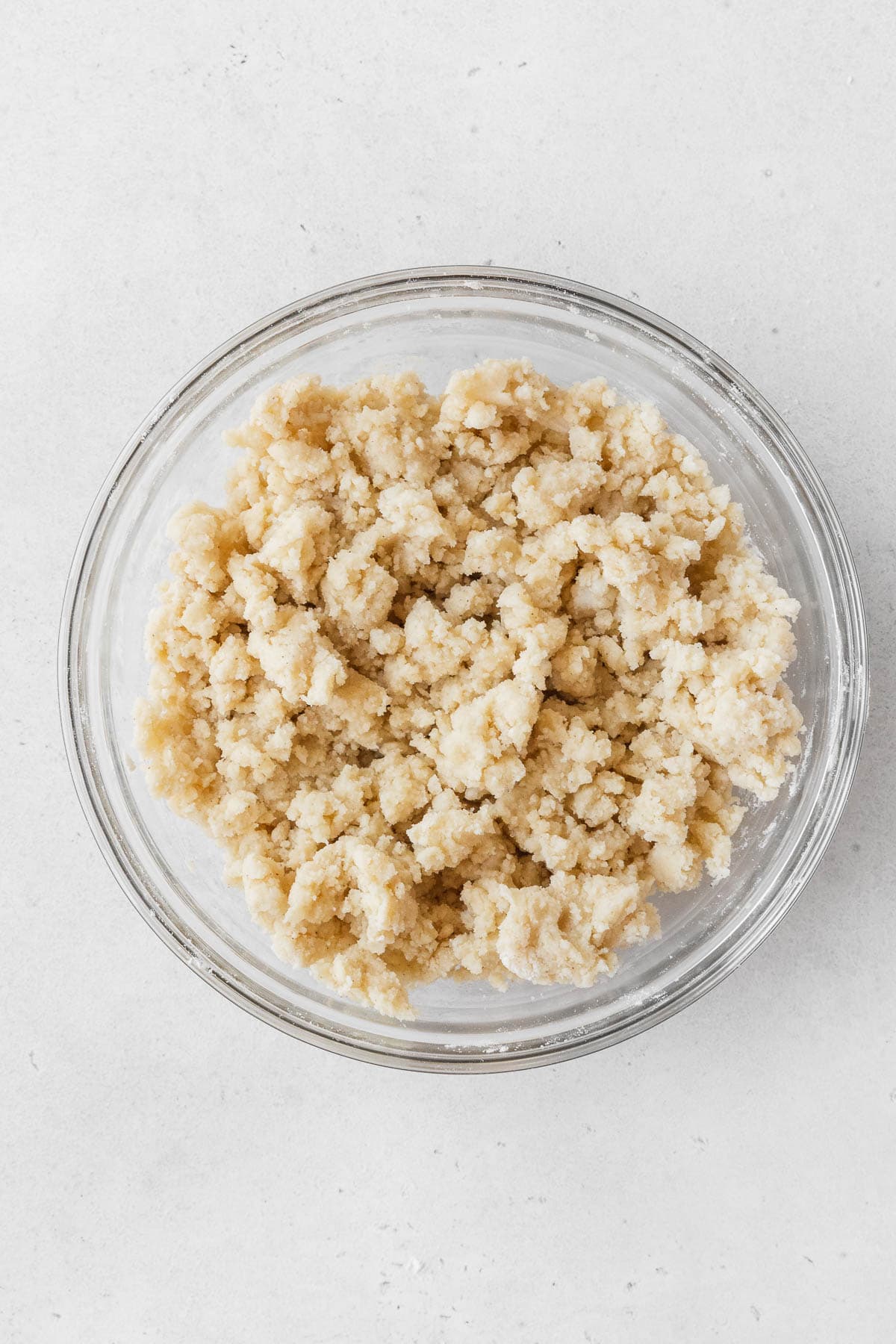 The dairy-free shortbread crust in the mixing bowl before pressing into the baking pan.