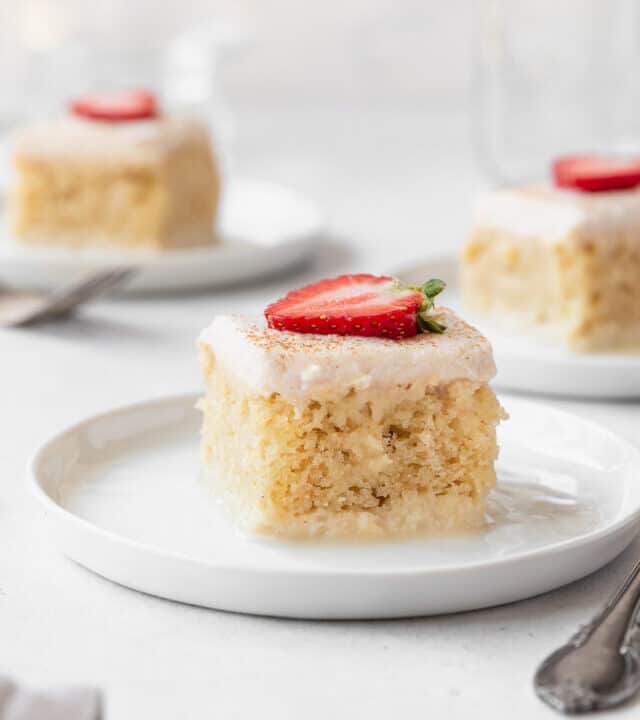 A closeup side shot of a slice of gluten-free and dairy-free tres leches cake on a dessert plate.