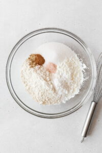 The dry ingredients for gluten-free pineapple upside down cake in a mixing bowl.