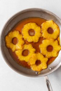 The pineapple and brown sugar mixture in a skillet.