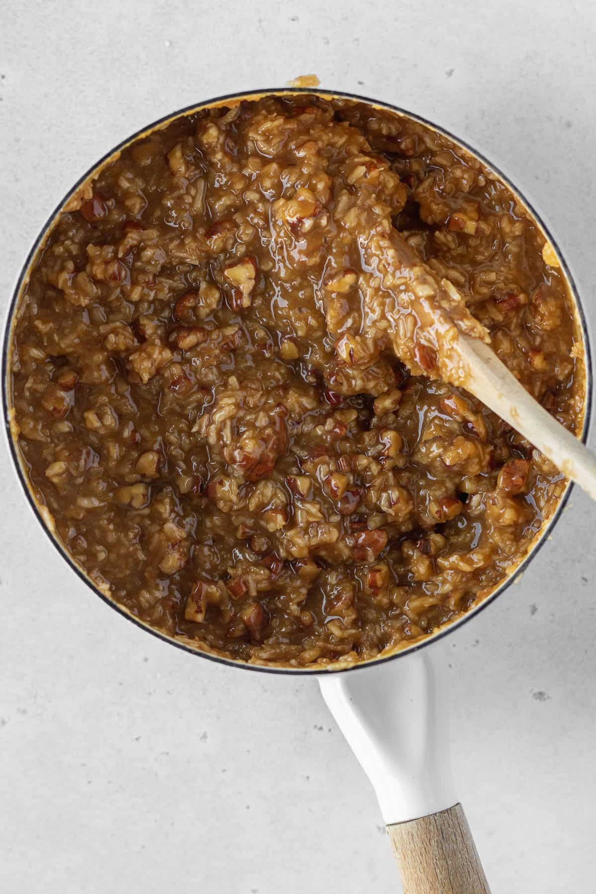 Dairy-free German chocolate cake frosting in a saucepan.