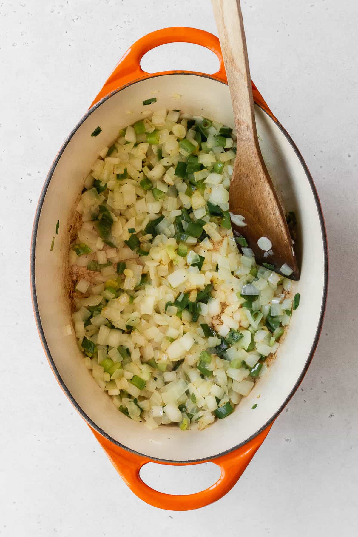 Sautéing the aromatics in a dutch oven.