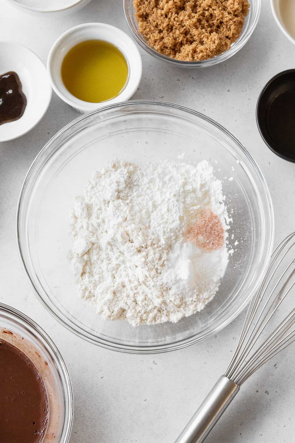 Dry ingredients for cupcakes in a glass bowl.