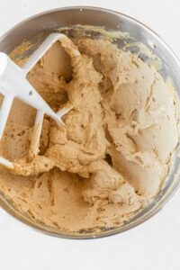 Butter and sugar creamed together in the bowl of a stand mixer.