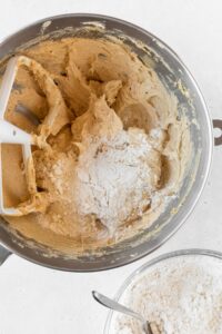 Dry ingredients added to the bowl to make cookie dough.