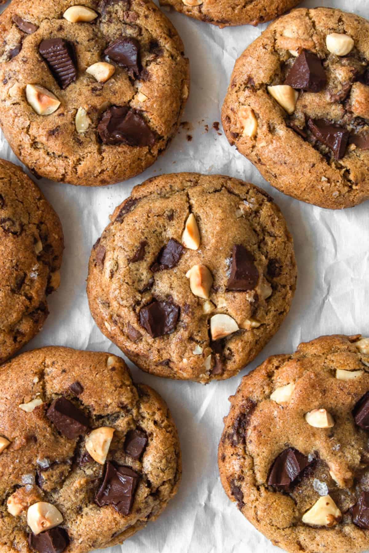 Overhead shot of browned butter chocolate chip cookies on parchment paper.