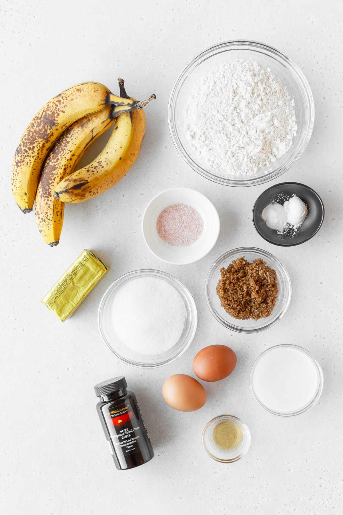 Ingredients to make gluten free banana bread measured out into bowls.