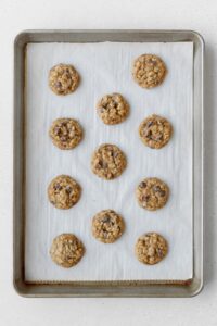 Baked oatmeal cookies on a baking sheet.