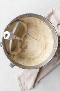Muffin batter in the bowl of a stand mixer.