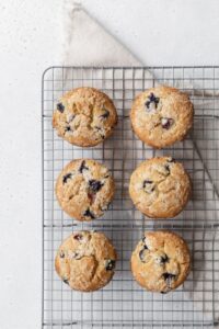 Gluten free blueberry muffins on a wire rack.