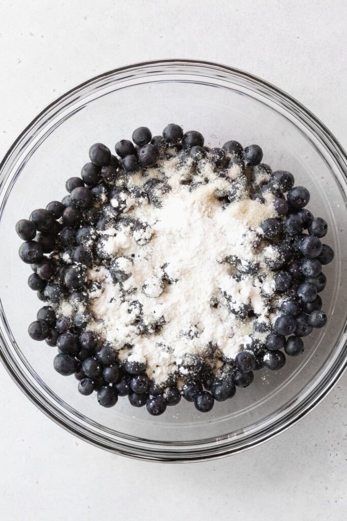 Blueberry filling ingredients in a glass bowl.